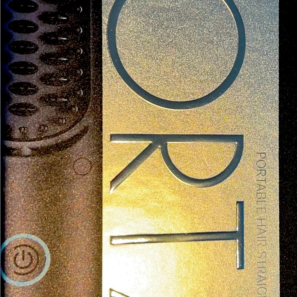 A portable hair straightening brush